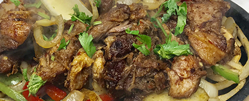 Pork Carnitas Fajitas at Guadalajara Grill, Bar, & Table Side Salsa in Tucson Arizona. Pork Carnitas Fajitas at Guadalajara Grill, Bar, & Table Side Salsa in Tucson Arizona.